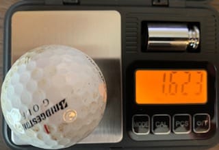 Pond Bridgestone ball on a scale weighing 1.623 ounces.