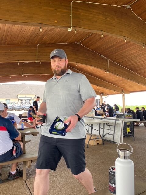 Tyler with Tour Response golf balls.