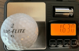 Top Flite ball on a scale weighing 1.63 ounces.