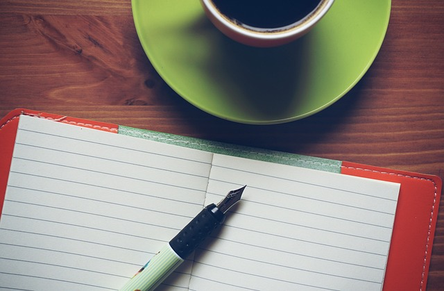 notepad, coffee, pen