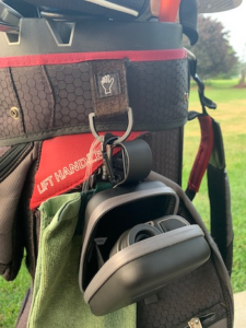 Blue tees golf rangefinder in case with case open on my golf bag