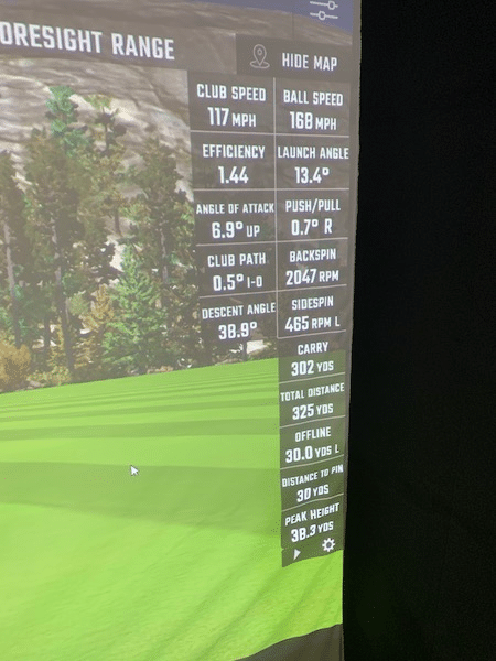 Tee shot with the Bridgestone e6 golf ball showing a total distance of 325 yards
