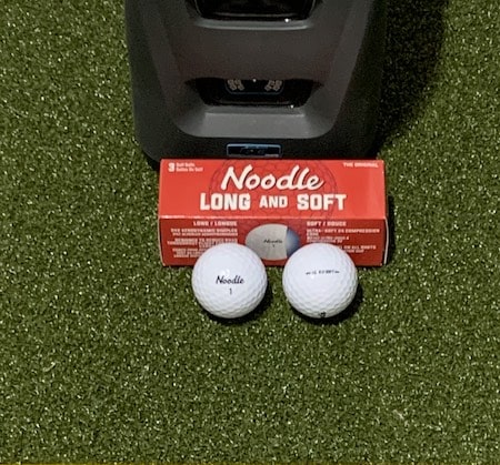 Noodle golf balls in front of a GC3 launch monitor