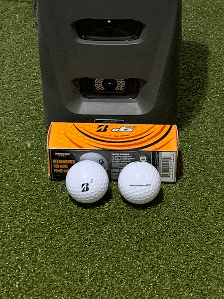 Bridgestone e6 golf balls in front of GC3 launch monitor