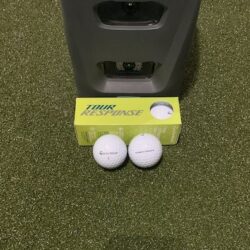 Tour Response golf balls in front of a GC3 launch monitor.
