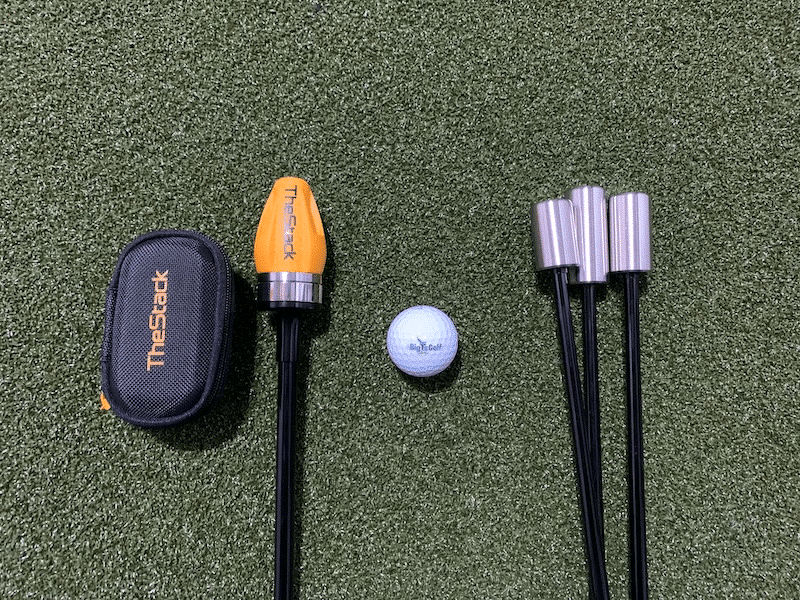 The stack system vs superspeed side-by-side with a golf ball in the middle.