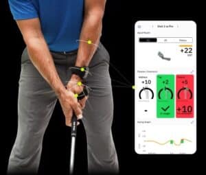 Golfer wearing the HackMotion sensor with the smartphone app measuring data.