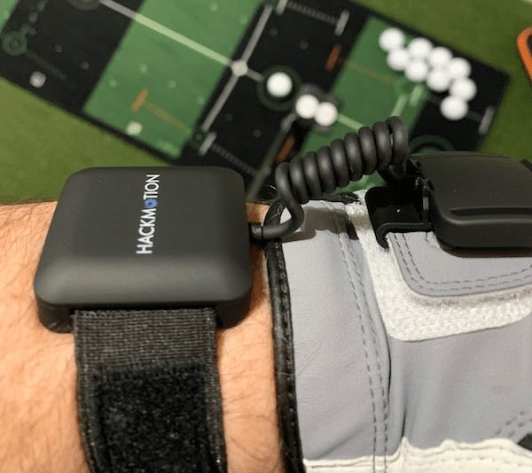 HackMotion Sensor on lead wrist with putting mat in background