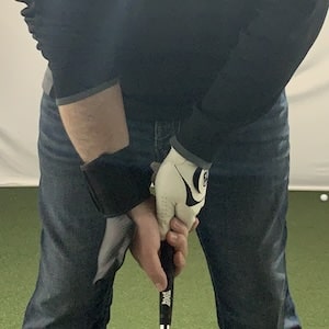 Golfer using the ProSENDR wrist cradle